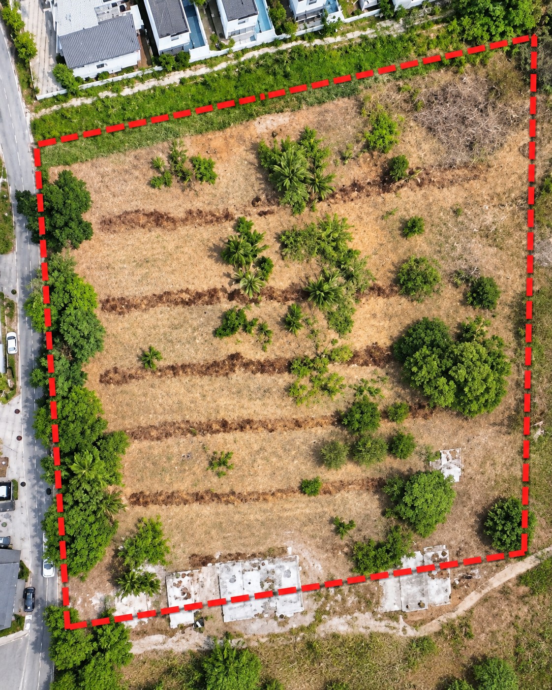 Owner-supplied top-down drone image with boundary overlay showing the parcel footprint