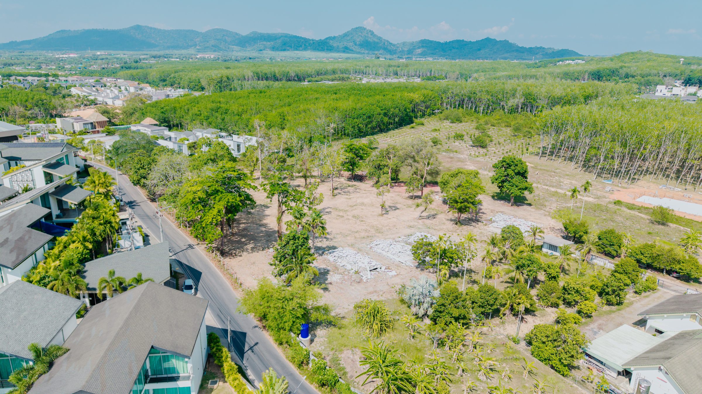 Drone view of the land and surrounding road access